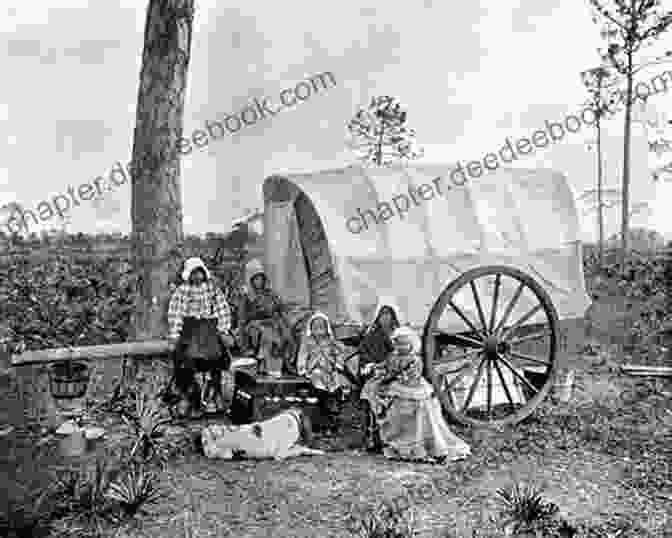 Black And White Photograph Of A Group Of Pioneers Posing In Front Of Their Covered Wagons The Oregon Trail 4 Digital Collection