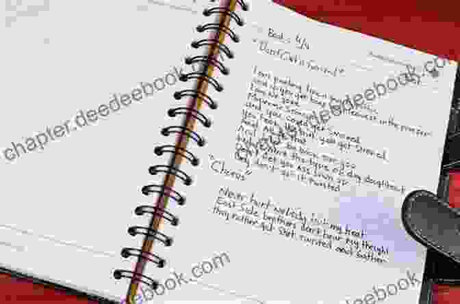 Close Up Of A Songwriter Writing Lyrics In A Notebook Songwriting: How To Write A Hit Song