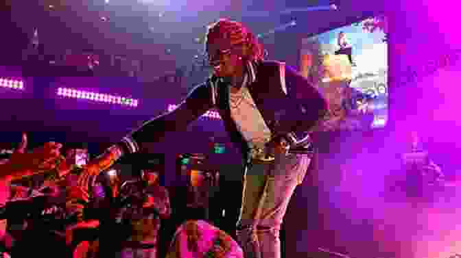 Young Thug Performing On Stage Giving A Thug More To Love 2